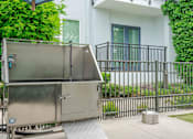 Thumbnail 22 of 22 - A stainless steel dishwasher is parked on a concrete driveway.