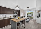 Thumbnail 2 of 35 - A modern kitchen with dark wood cabinets and a white countertop.