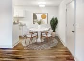 Thumbnail 5 of 27 - an open kitchen and dining room with a white table and chairs
