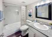Thumbnail 12 of 27 - a bathroom with a sink toilet and bath tub