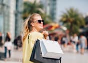 Thumbnail 27 of 28 - young woman with shopping bags in the city