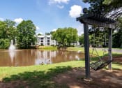 Thumbnail 19 of 44 - Sutter Lake Apartments Pond with Swing