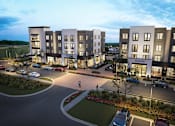 Thumbnail 4 of 5 - Luxury Apartments in Murfreesboro, TN, with In-Unit Washer and Dryer - Vintage 1959 - A Parking Lot With Landscaped Grounds And A Welcoming Community Entrance.