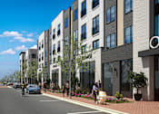 Thumbnail 1 of 5 - Murfreesboro, TN, Luxury Apartments Near Walgreens - Vintage 1959 - Street View With Tall Windows, Street Level Storefronts, Landscaped Sidewalks, Parked Cars, And Pedestrians.