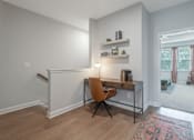 Thumbnail 30 of 56 - A room with a desk and a chair.
