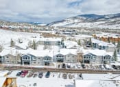 Thumbnail 1 of 43 - a city covered in snow with mountains in the background