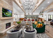 Thumbnail 3 of 50 - a living room with couches and chairs and a fireplace