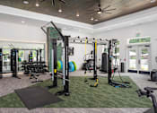 Thumbnail 9 of 50 - the home has a gym with weights and cardio equipment