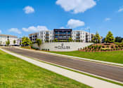Thumbnail 26 of 26 - The Collier apartments are located on a tree-lined street.