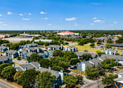 Thumbnail 22 of 22 - A suburban area with houses and a road.