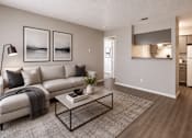 Thumbnail 3 of 22 - A modern living room with a white sofa, a coffee table, and a grey rug.