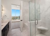 Thumbnail 28 of 44 - a bathroom with a tub and a sink