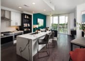 Thumbnail 19 of 44 - a kitchen and dining area in a 555 waverly unit