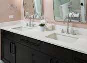 Thumbnail 23 of 44 - a bathroom with two sinks and two mirrors