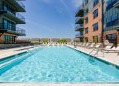 Thumbnail 3 of 28 - our apartments have a resort style pool with lounge chairs