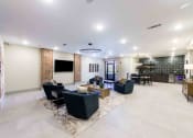 Thumbnail 12 of 28 - a living room with couches and chairs and a tv