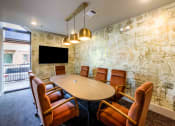 Thumbnail 14 of 28 - a conference room with a table and chairs