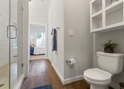 Thumbnail 33 of 45 - a bathroom with a toilet and a glass shower
