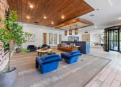 Thumbnail 7 of 45 - the lobby or reception area of a house with blue chairs