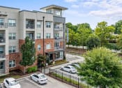 Thumbnail 41 of 45 - an aerial view of an apartment building with cars parked in front