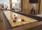 Thumbnail 22 of 29 - Panama City Beach, FL Pet-Friendly Apartments - Clubroom with Shuffleboard, Billiards, and Coffee Station.