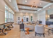 Thumbnail 2 of 49 - A spacious living room with a pool table and comfortable seating.