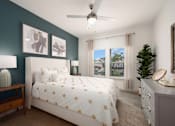 Thumbnail 24 of 45 - A bedroom with a bed, nightstand, and a ceiling fan.