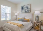 Thumbnail 9 of 10 - a bedroom with a bed and a window