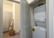 Thumbnail 13 of 18 - a washer and dryer in a laundry room
