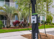 Thumbnail 35 of 37 - an electric charger on a pole in front of a building