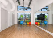 Thumbnail 14 of 37 - a large room with hardwood floors and large windows