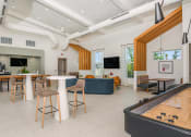 Thumbnail 7 of 37 - a room with a foosball table and a couch