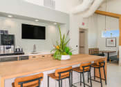 Thumbnail 6 of 37 - a kitchen with a large wooden table and chairs