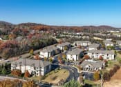 Thumbnail 30 of 30 - a aerial view of a neighborhood with houses and trees