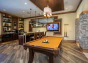 Thumbnail 15 of 30 - a rec room with a pool table and a tv