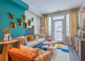 Thumbnail 5 of 20 - a living room filled with furniture and a large window
