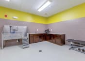 Thumbnail 16 of 20 - a large room with a sink and a bench