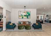 Thumbnail 11 of 38 - a living room with a couch and chairs