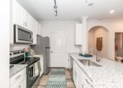 Thumbnail 3 of 38 - a kitchen with a counter top and a sink