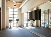Thumbnail 36 of 47 - a large room with a tv and video equipment in a room with windows