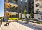 Thumbnail 45 of 47 - Studios in Downtown Memphis, TN - The Landing - Terrace with Bench and Planters.