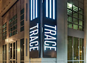Thumbnail 36 of 36 - A building with the word Trace on it is shown.