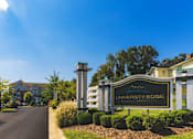 Thumbnail 19 of 25 - A sign for University Edge stands in front of a building.