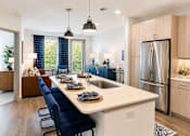 Thumbnail 14 of 30 - A modern kitchen with a long white island and blue chairs.