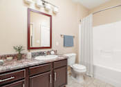 Thumbnail 36 of 44 - A bathroom with a sink, toilet, and bathtub.