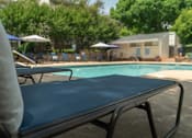 Thumbnail 21 of 35 - A blue pool table in the foreground with a pool table in the background.