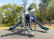 Thumbnail 25 of 35 - a playground with a set of slides in a park