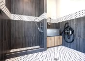 Thumbnail 24 of 35 - a bathroom with black and white tile