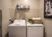 Thumbnail 11 of 35 - a washer and dryer in a laundry room