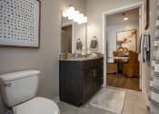 Thumbnail 8 of 35 - a bathroom with a toilet and a sink